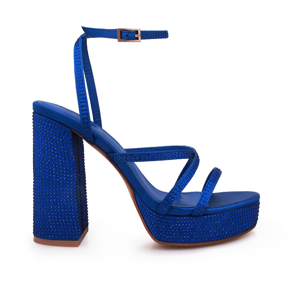 Cobalt colored platform heels with crystal embellishment and ankle buckle closure - side view