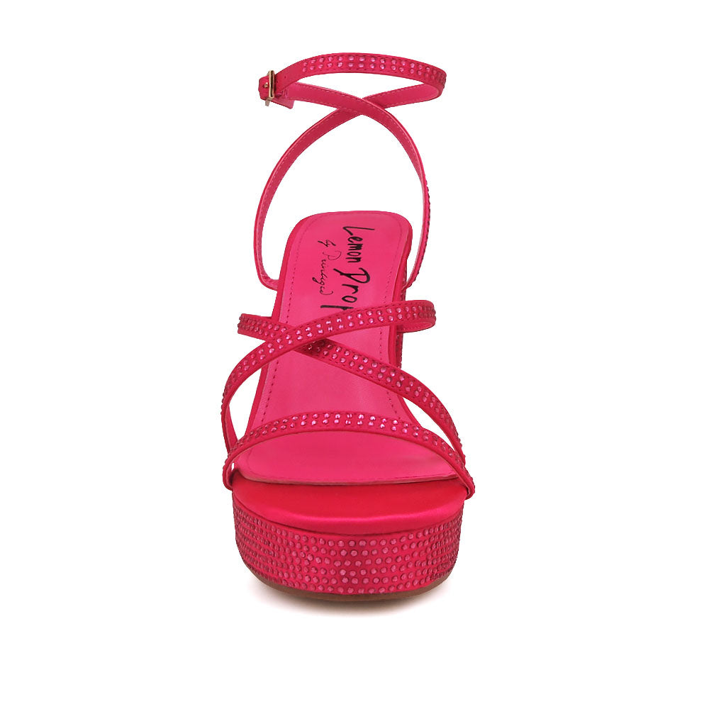 Fuchsia colored platform heels with crystal embellishment and ankle buckle closure - front view