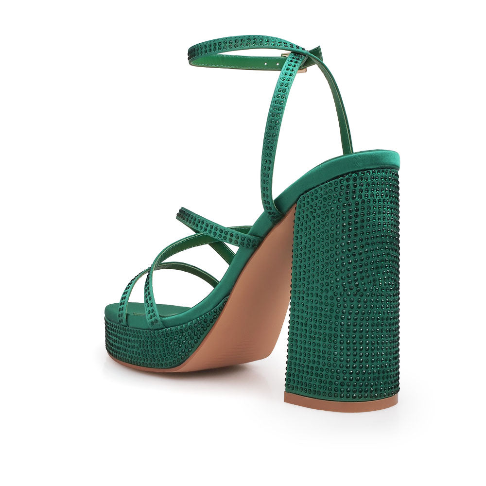 Green colored platform heels with crystal embellishment and ankle buckle closure - back view