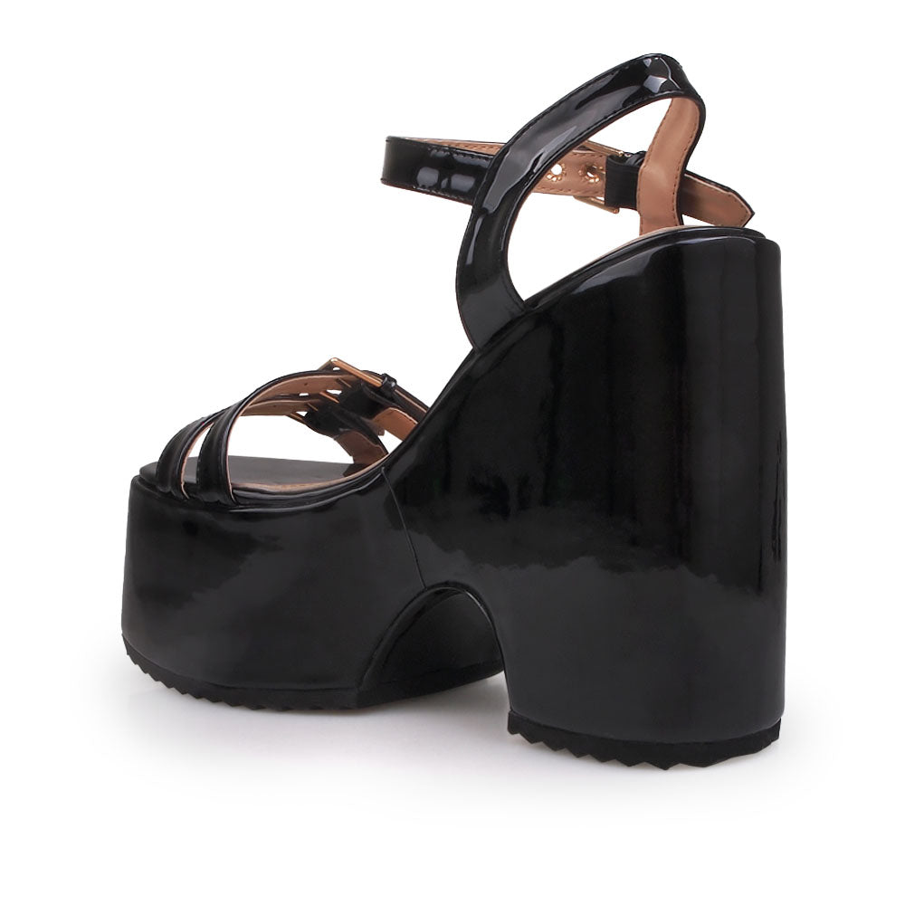 Black colored platforms sandals with double buckle strap design and ankle buckle closure - back view