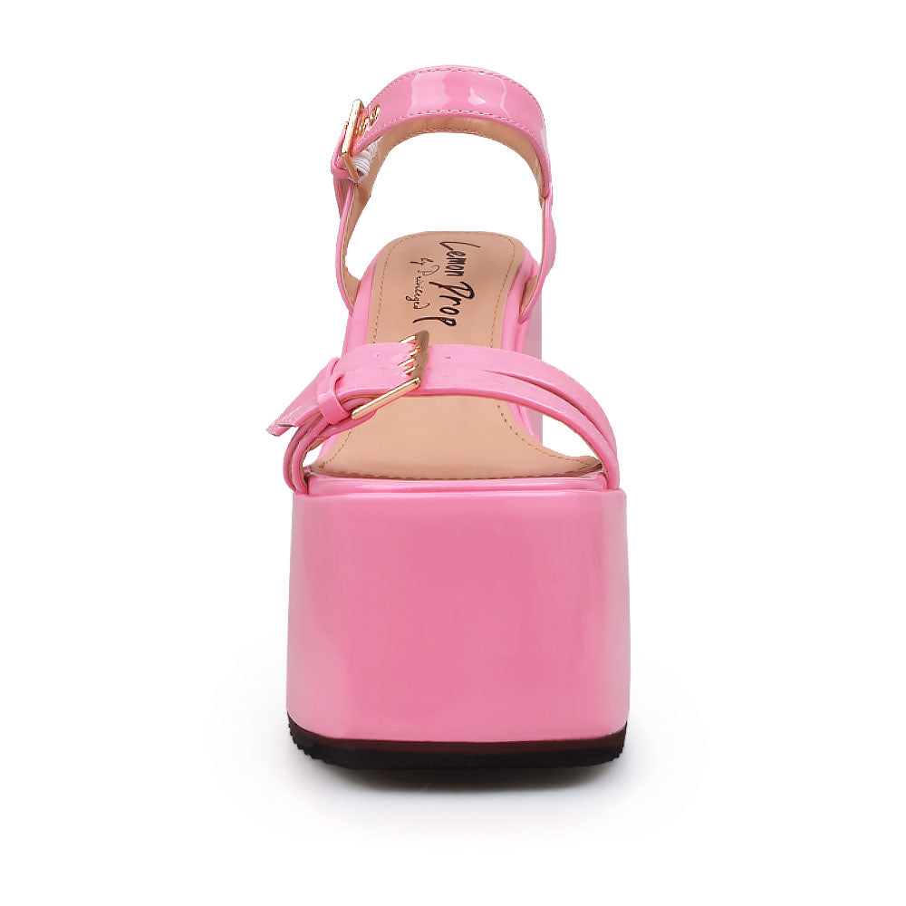 Pink colored platforms sandals with double buckle strap design and ankle buckle closure - front view