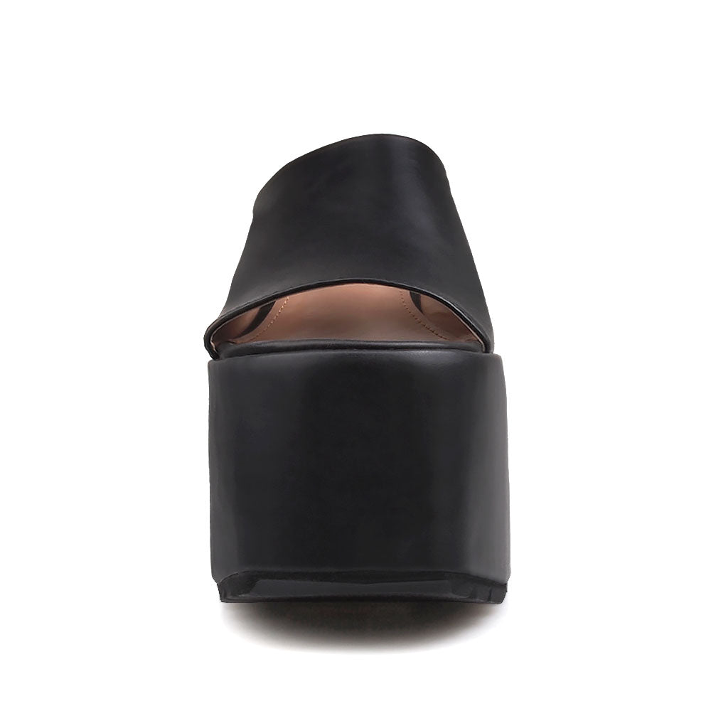 Black platforms with an open toe and slip-on style - front view