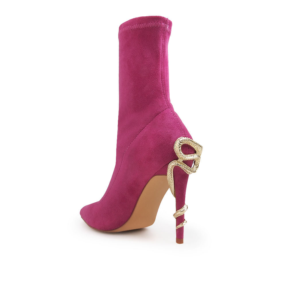 Fuchsia pointed toe stiletto heels boots with snake design on heels - back view