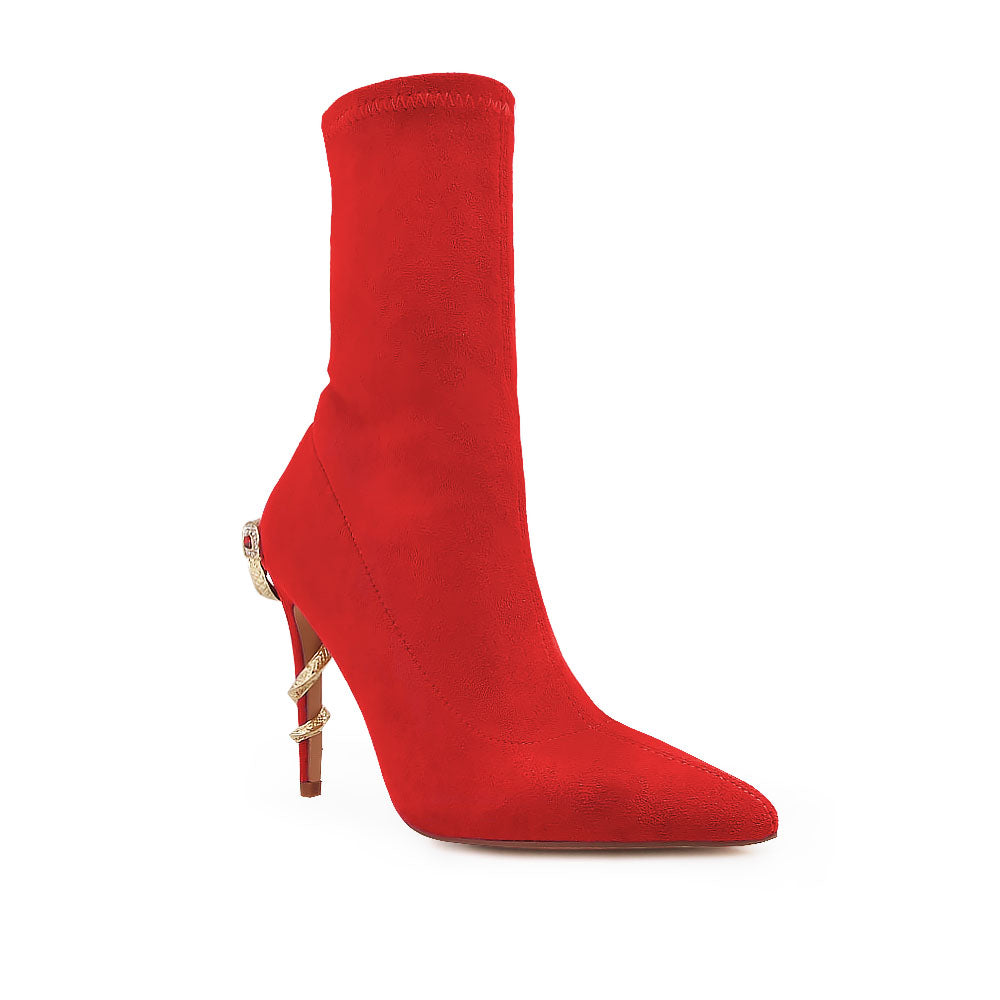 Red pointed toe stiletto heels boots with snake design on heels - corner view