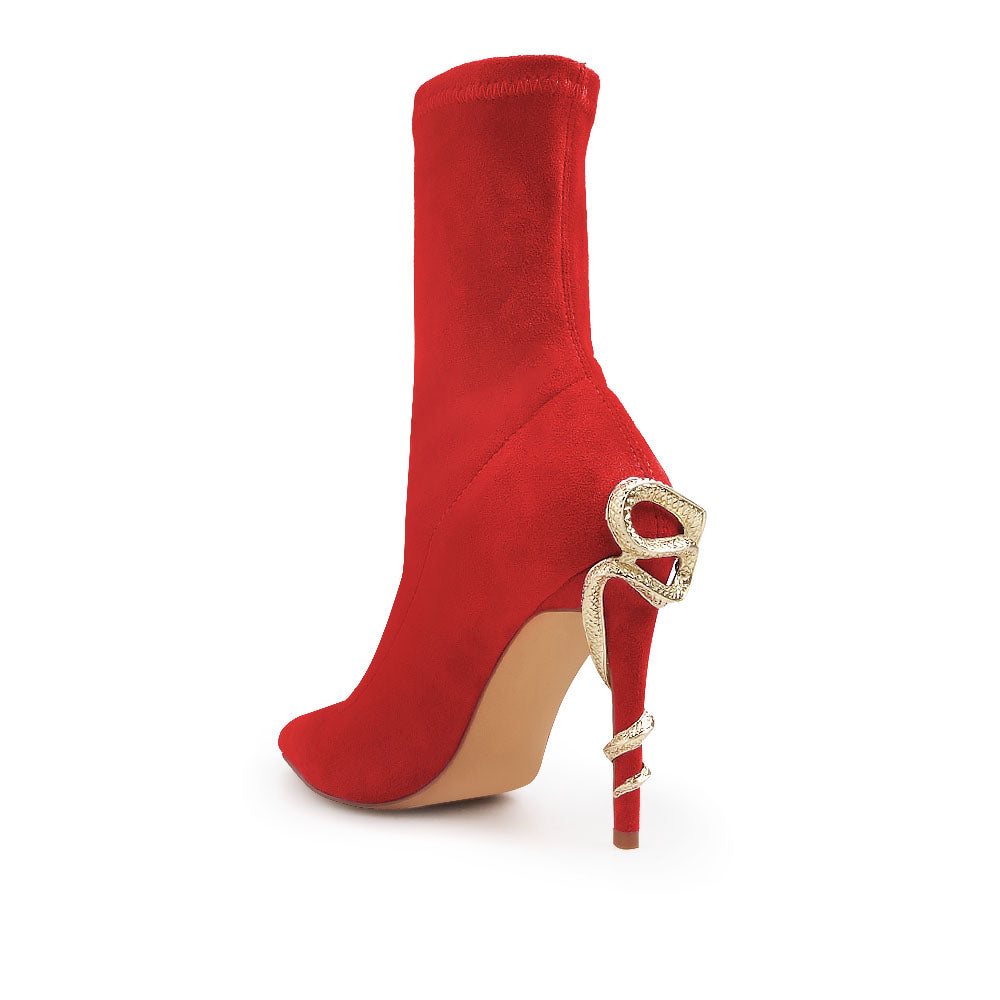 Red pointed toe stiletto heels boots with snake design on heels - back view