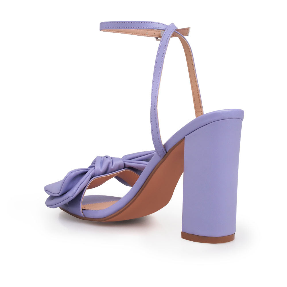 Lilac heels with bow design upper and ankle buckle clasp - back view