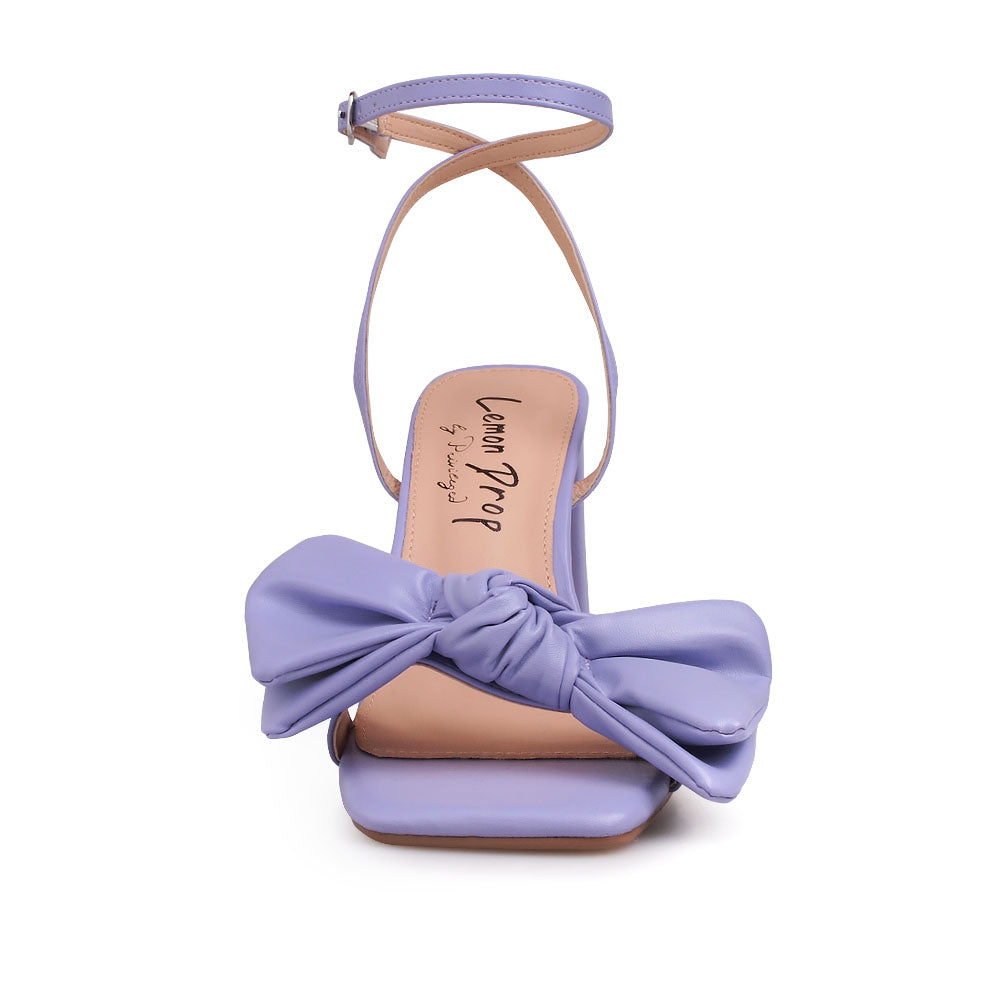 Lilac heels with bow design upper and ankle buckle clasp - front view