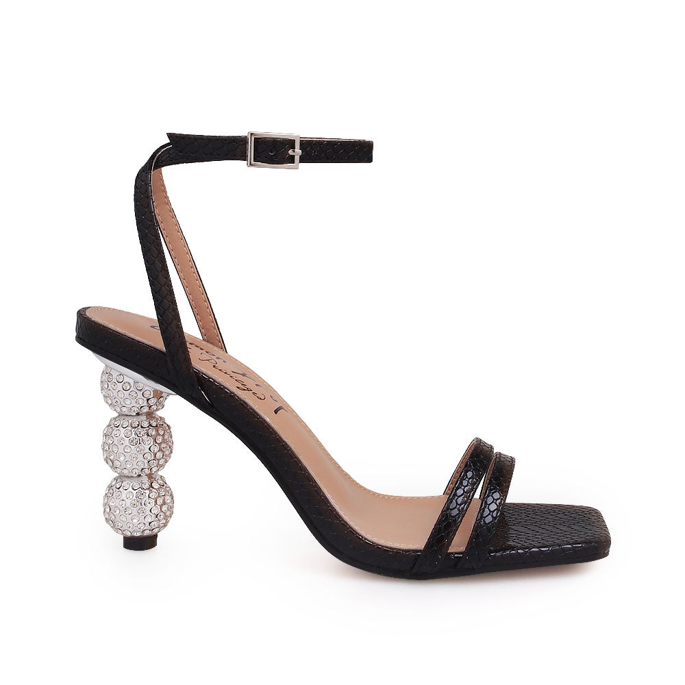 Silver crystal ball heel with black upper and ankle buckle closure - side view