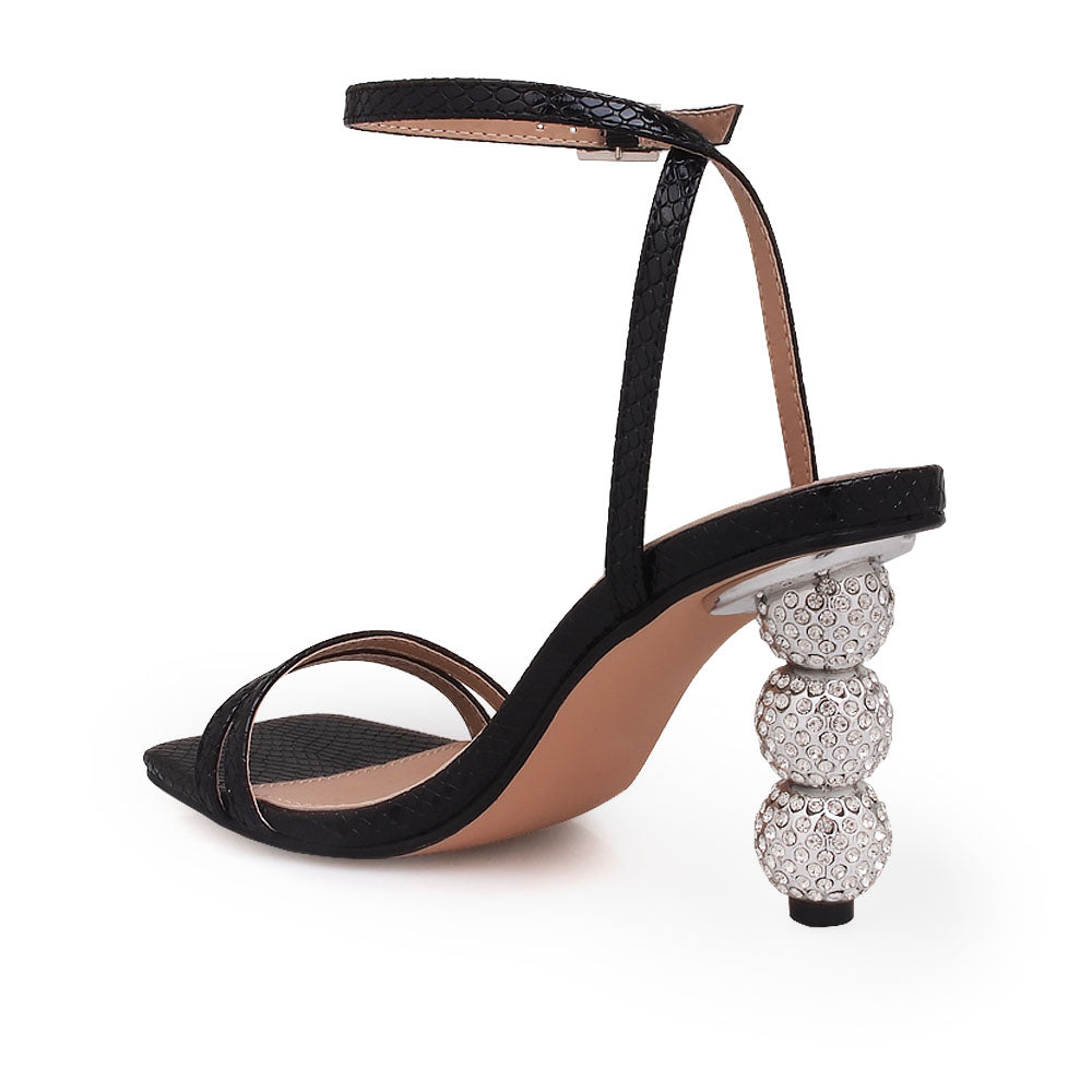 Silver crystal ball heel with black upper and ankle buckle closure - back view