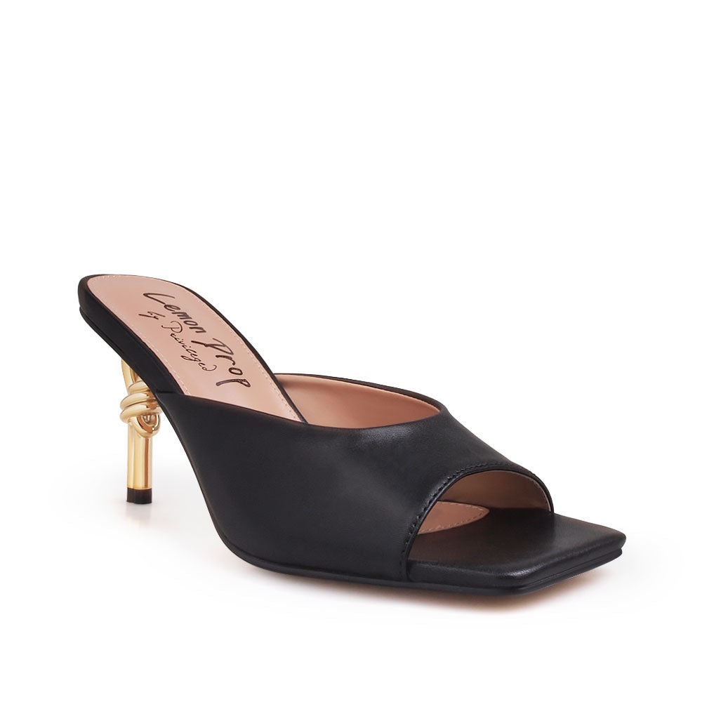 Golden knot metal heels with black colored upper and squared toe sandals - corner view