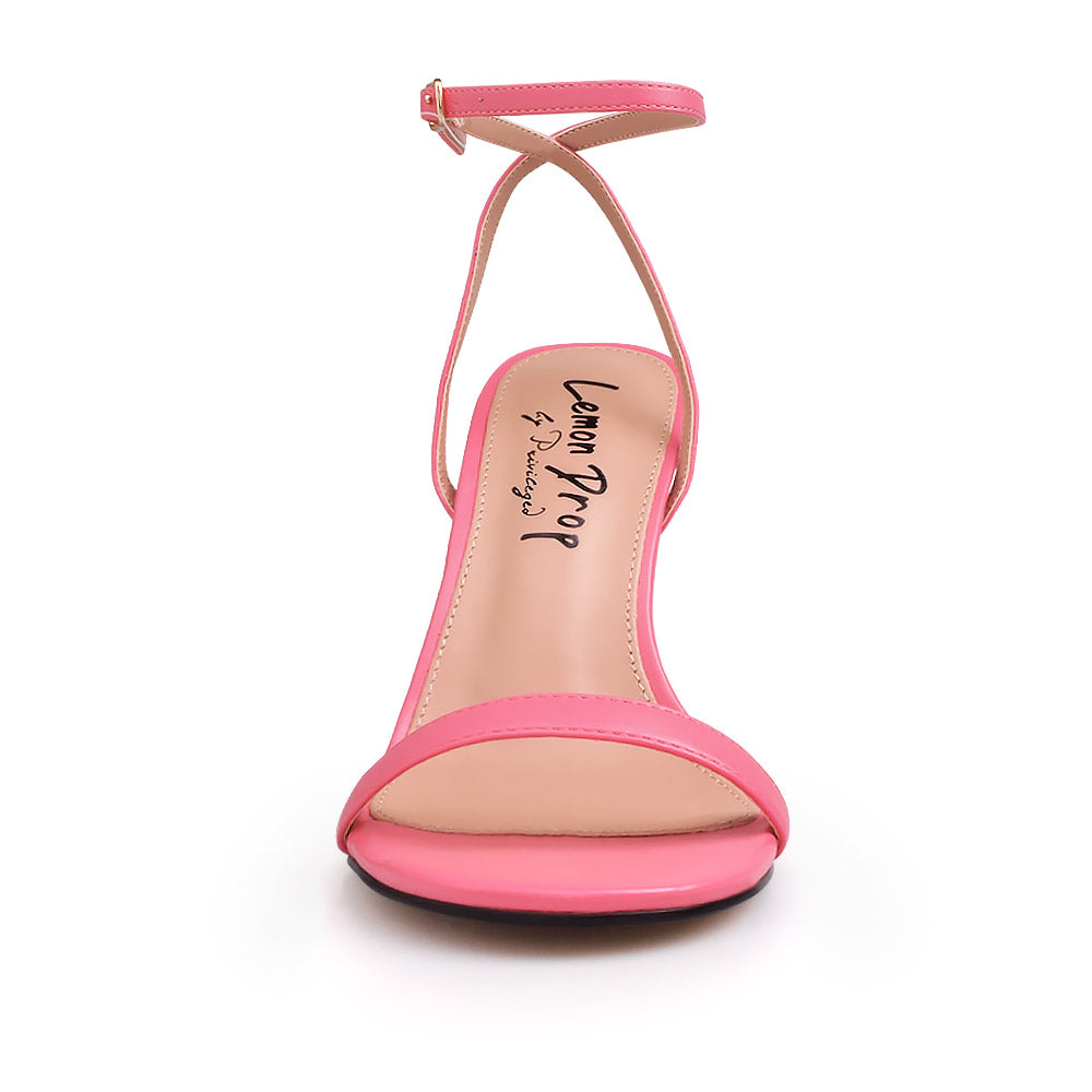 Coral color upper and ankle buckle closure on gold metallic heels - front view