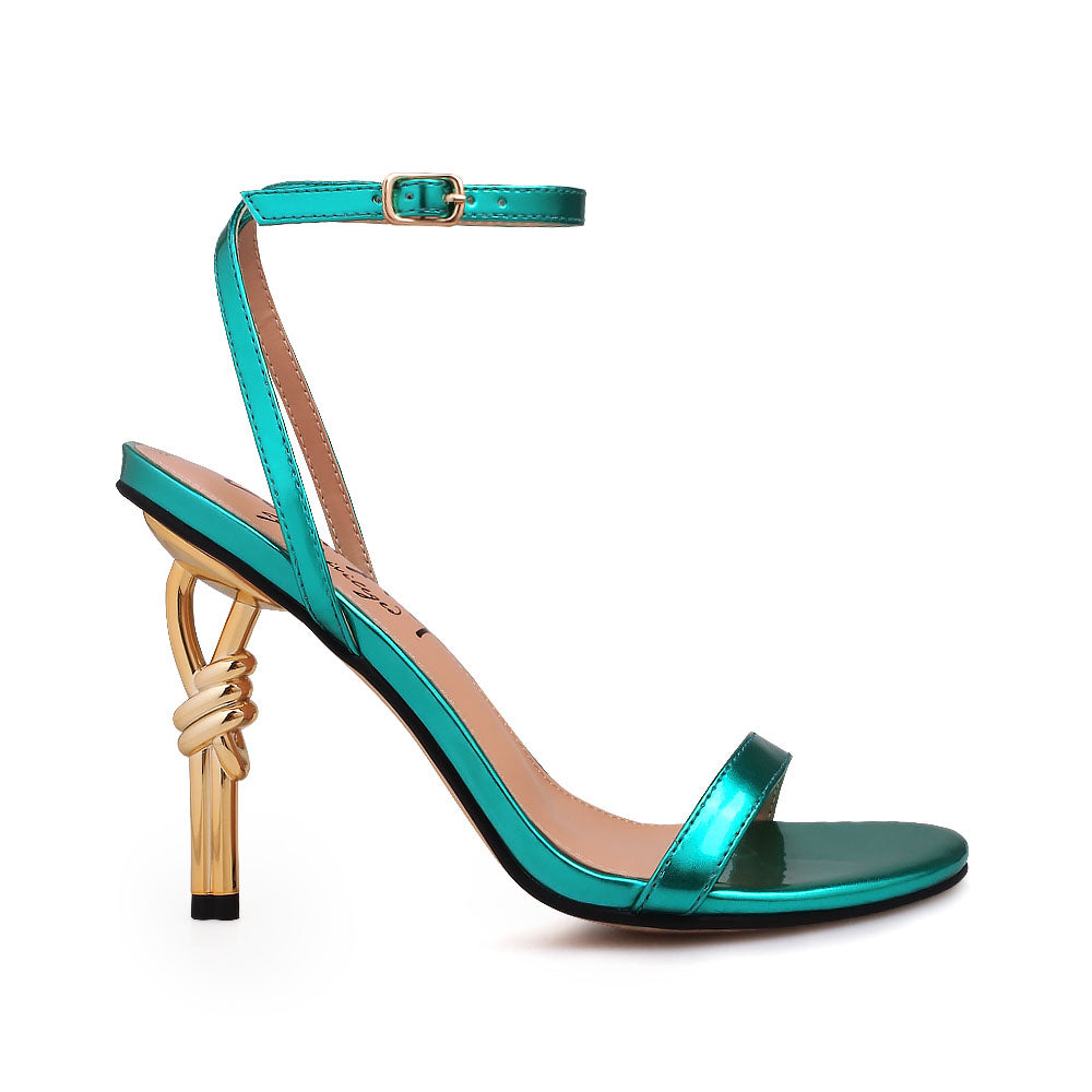Gold colored metallic heels with teal upper and ankle buckle closure - side view
