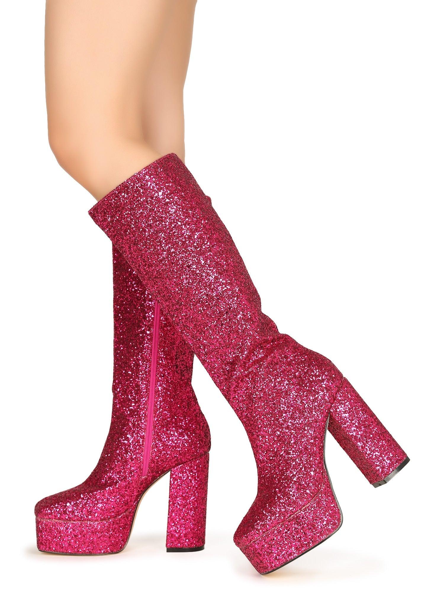 Glistening fuchsia-colored knee high platform boots for women with glitter accent and side zipper