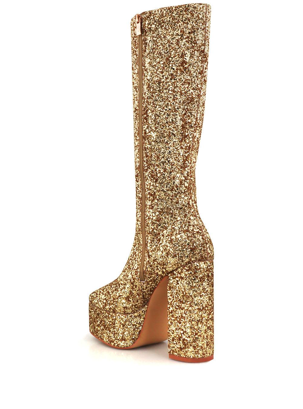 Golden-colored women's knee high platform boots with glitter accent and side zipper-posterior view