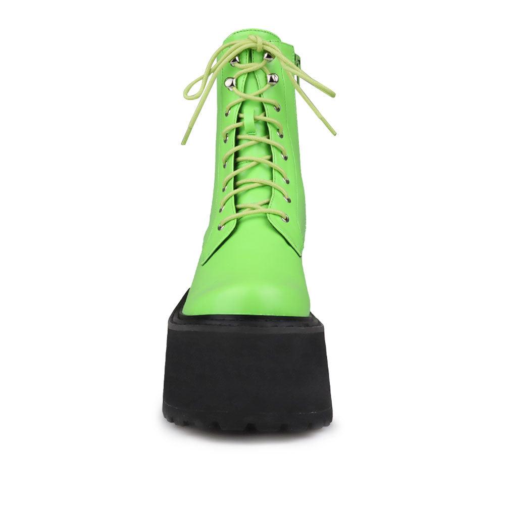 Green colored women platform boots with black base-front view
