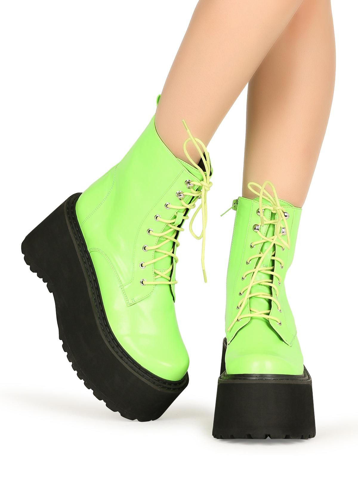 Green colored women platform boots with black base