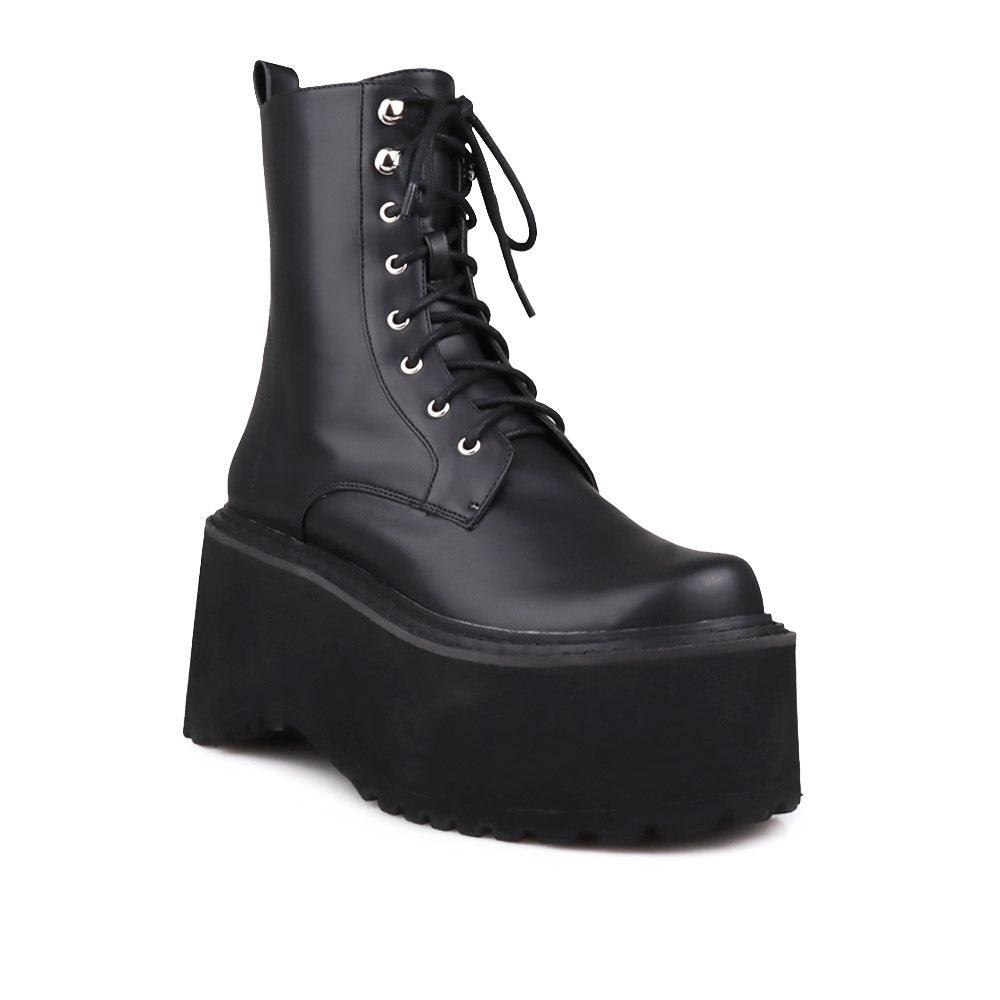 Black colored women platform boots with black base-corner view