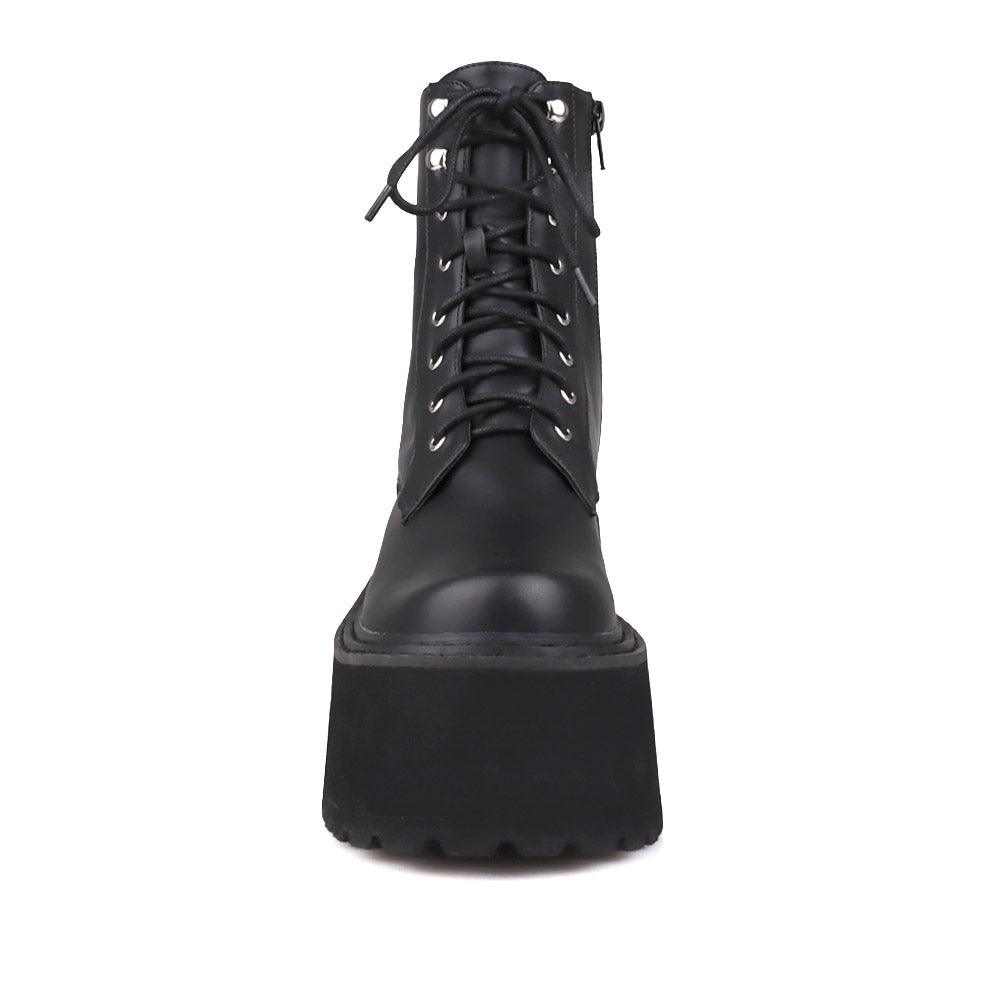 Black colored women platform boots with black base-front view