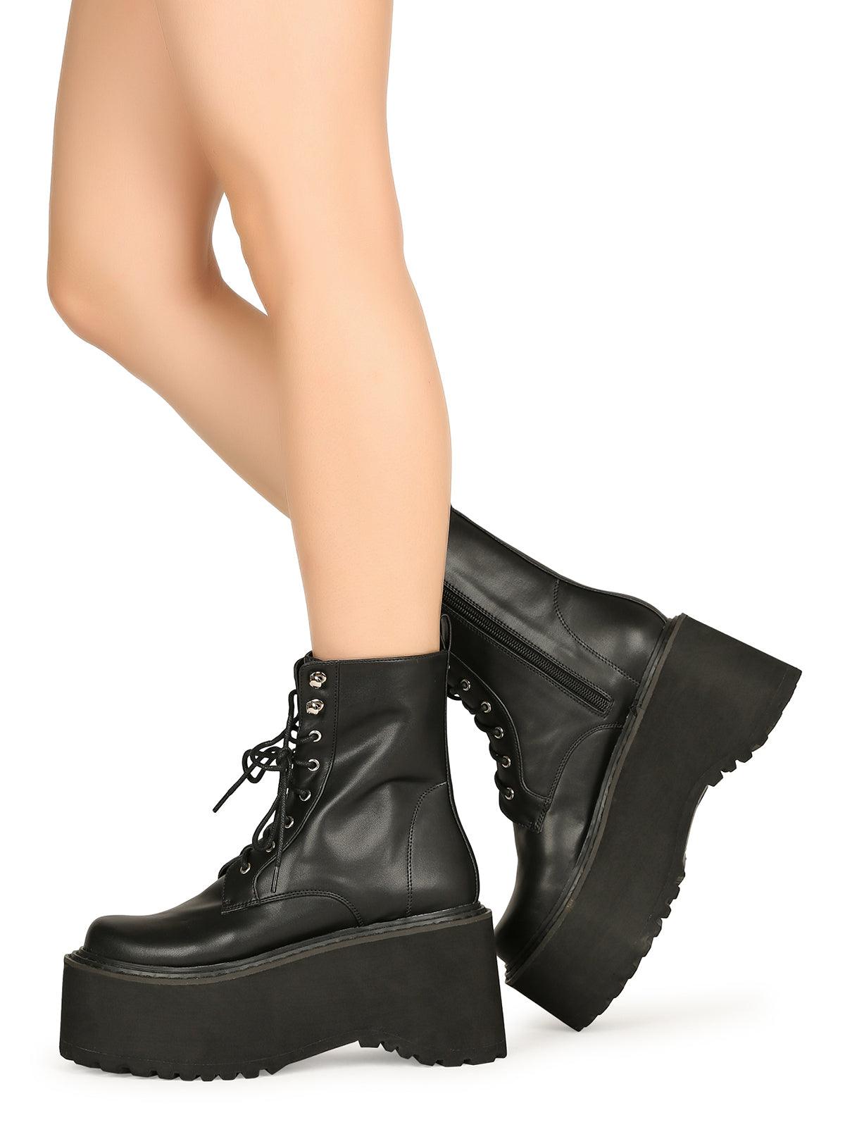 Black colored women platform boots with black base