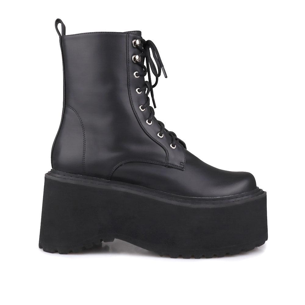 Black colored women platform boots with black base-side view