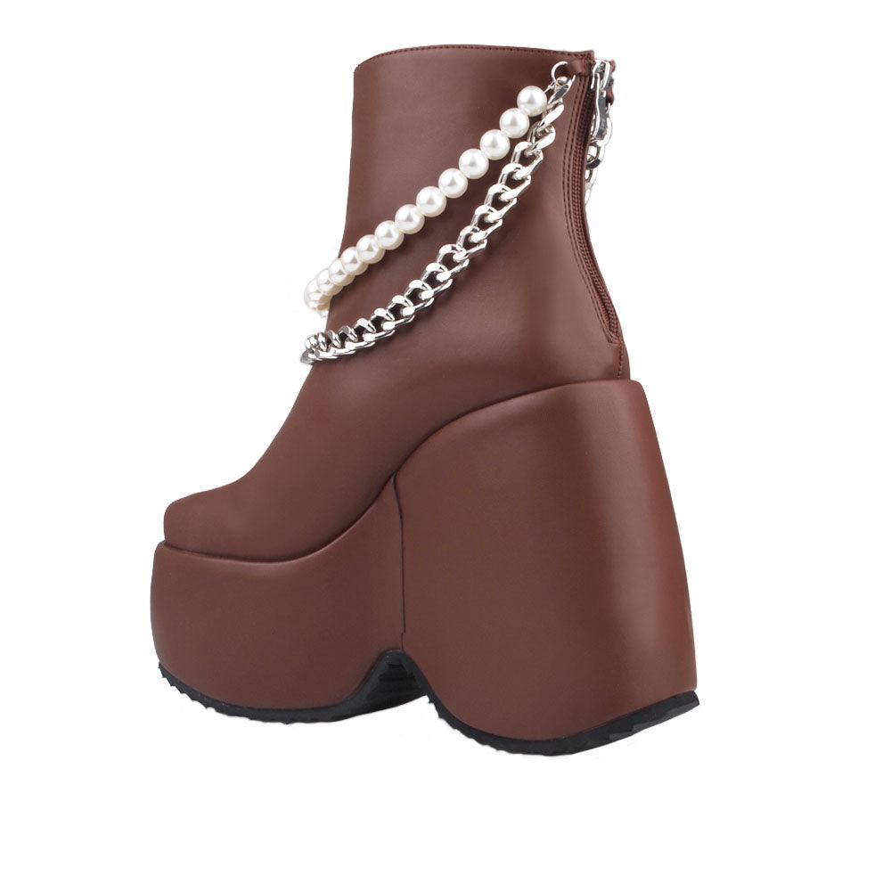 Dark brown colored women bootie platforms with pearl and silver embellished strap-posterior view