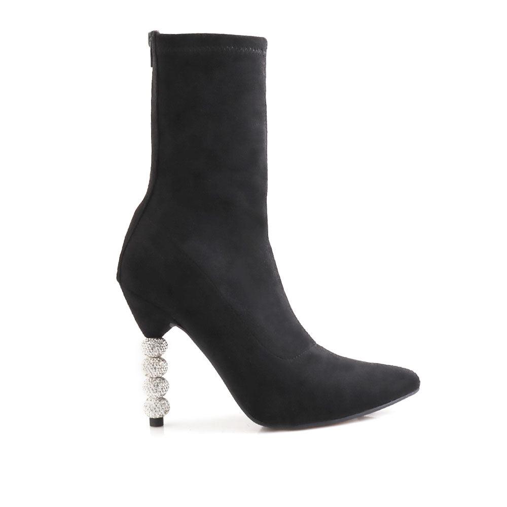 Ankle high boot in black with beaded heels and rear zipper closure.
