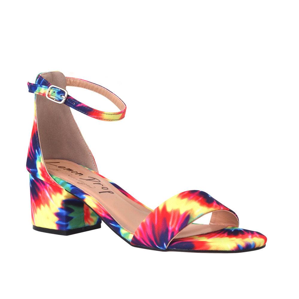 Tie dye heel flats with an ankle buckle closure and strap-corner view