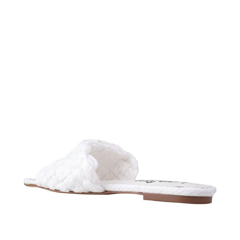 Women's woven straw flat slippers in a white-color-posterior view