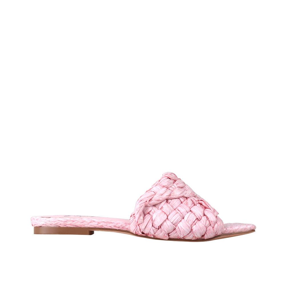 Women's pink-colored woven straw flat slippers-side view