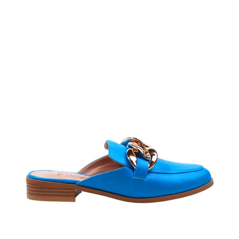 Slip-on turquoise colored flats with gold chain upper.