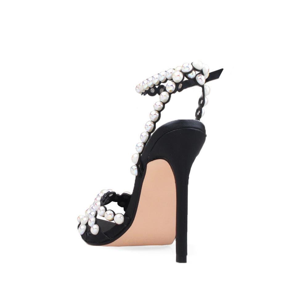 Women's black-colored pearl-encrusted open-toed heels with ankle buckle closure-posterior view