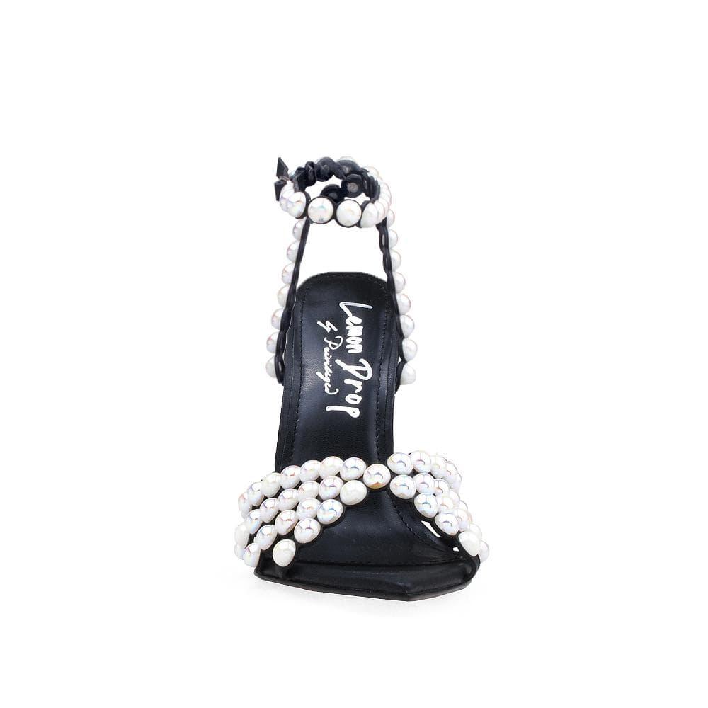 Women's black-colored pearl-encrusted open-toed heels with ankle buckle closure-front view