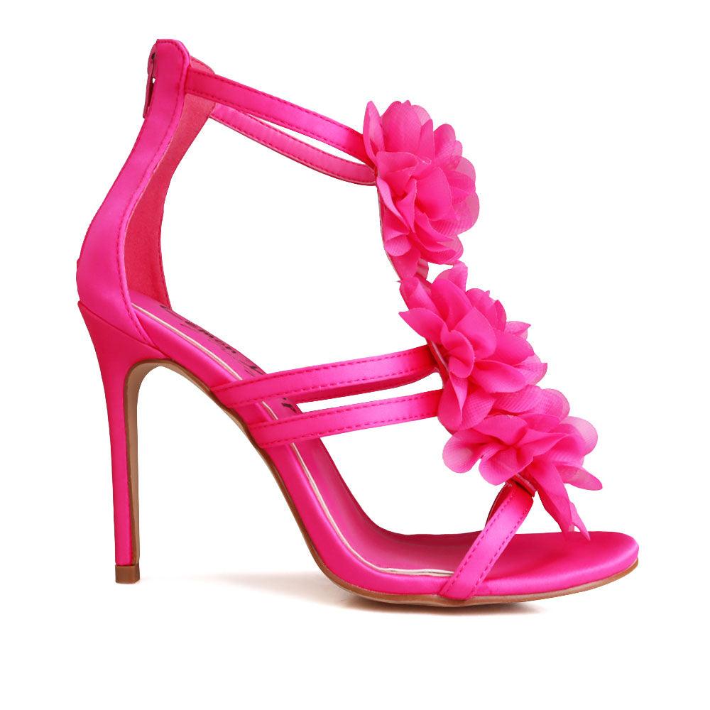 Women's fuchsia-colored heels featuring a satin extravagant floral strapped top and rear zipper clasp-side view