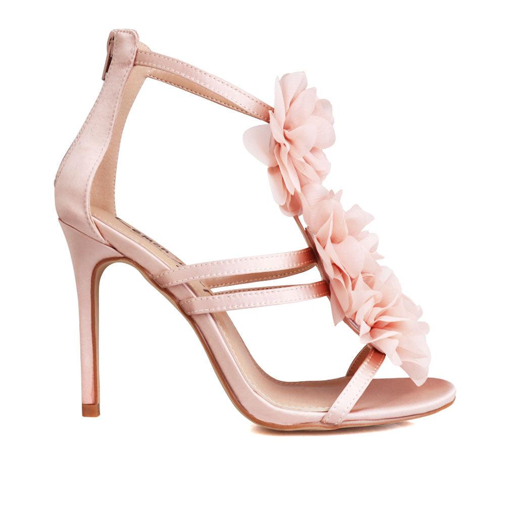Women's nude-colored shoes with satin floral strapped top and back zipper closure-side view