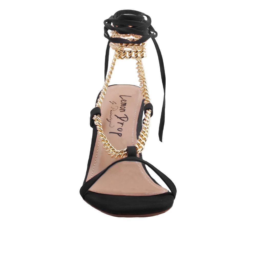 Women heels with gold metal chains and lace tie up in black-front view