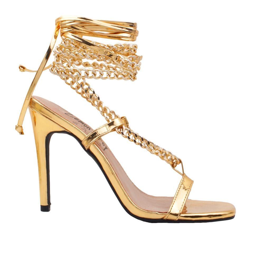 Women heels with gold metal chains and lace tie up in gold-side view