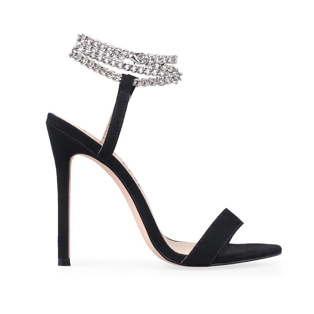 Slip-on shoes in black color with a silver ankle wrap chain