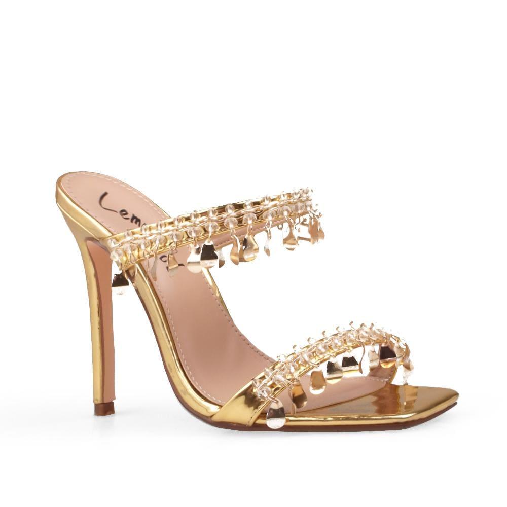 Gold vegan patent leather women's heel embellished with gold metallic charms-corner view