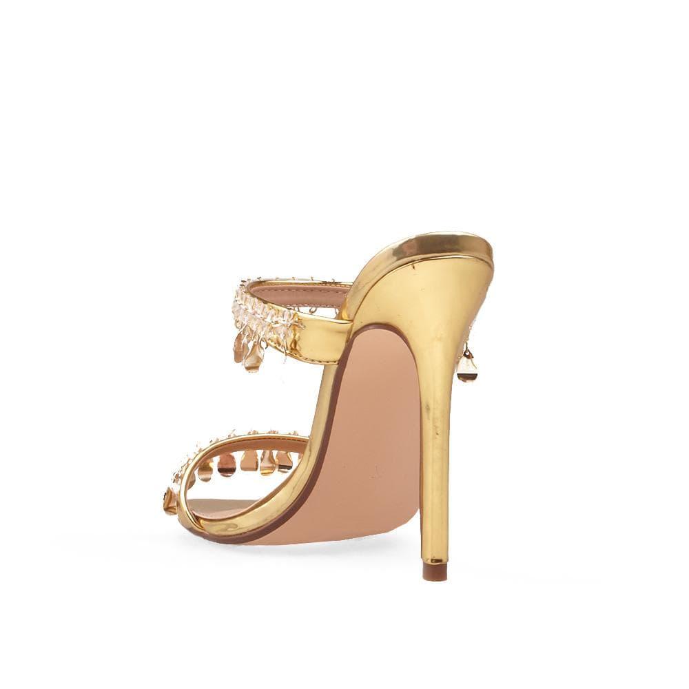 Gold vegan patent leather women's heel embellished with gold metallic charms-posterior view