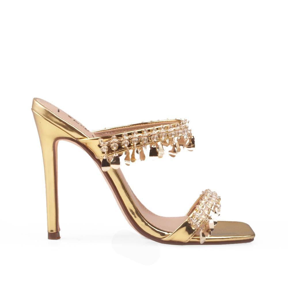 Gold vegan patent leather women's heel embellished with gold metallic charms-side view