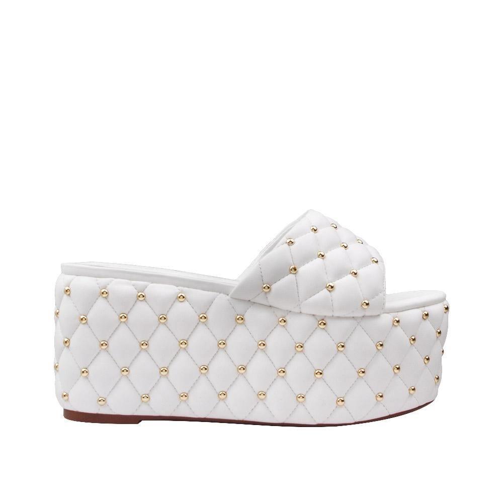Women's platform shoes in white-color with metallic studs and slip on design-side view
