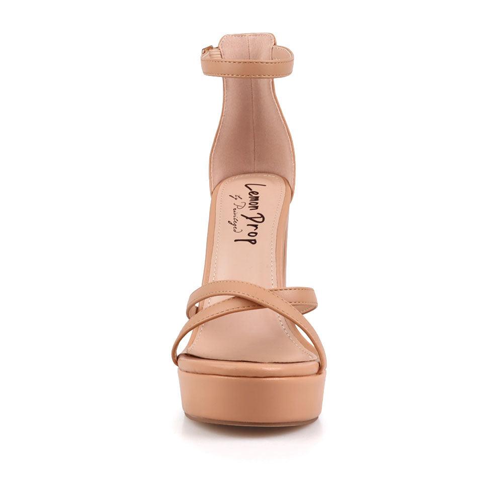 Nude platform heels with ankle buckle closure and open toe design - front view