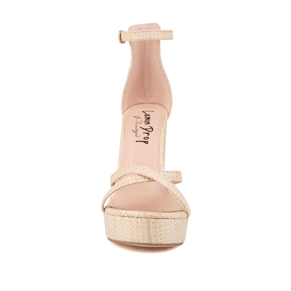 Natural platform heels with ankle buckle closure and open toe design - front view