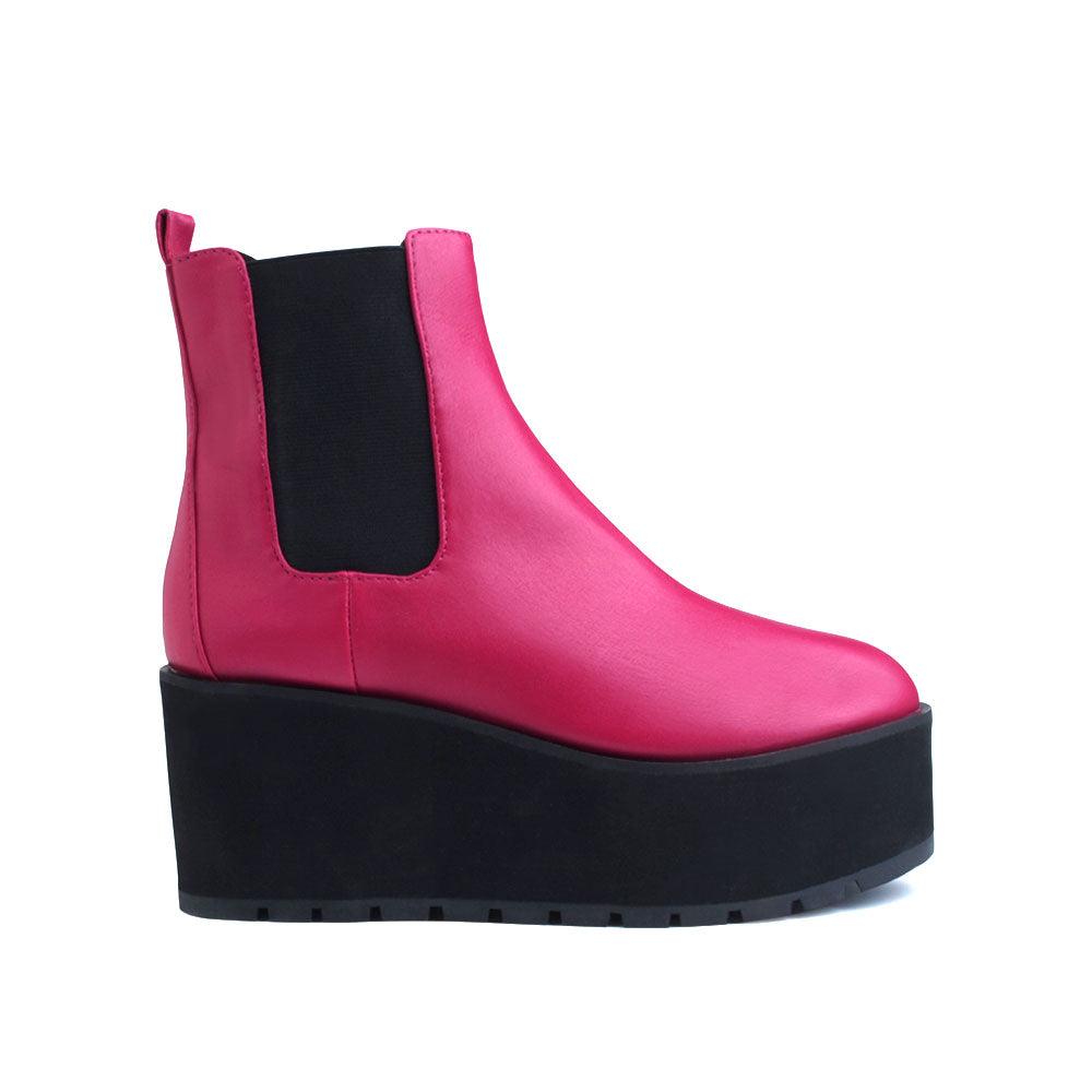 Pink colored women booties with black platform-side vie