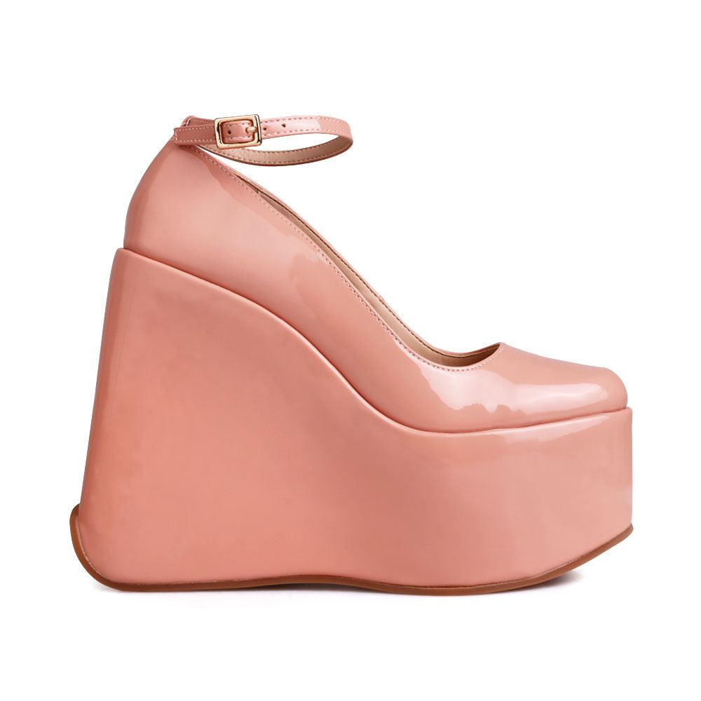 Platform boots in nude with an ankle buckle fastening