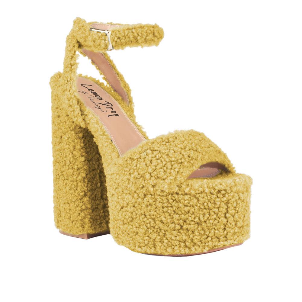 Yellow shag covered women's platform heels-corner view