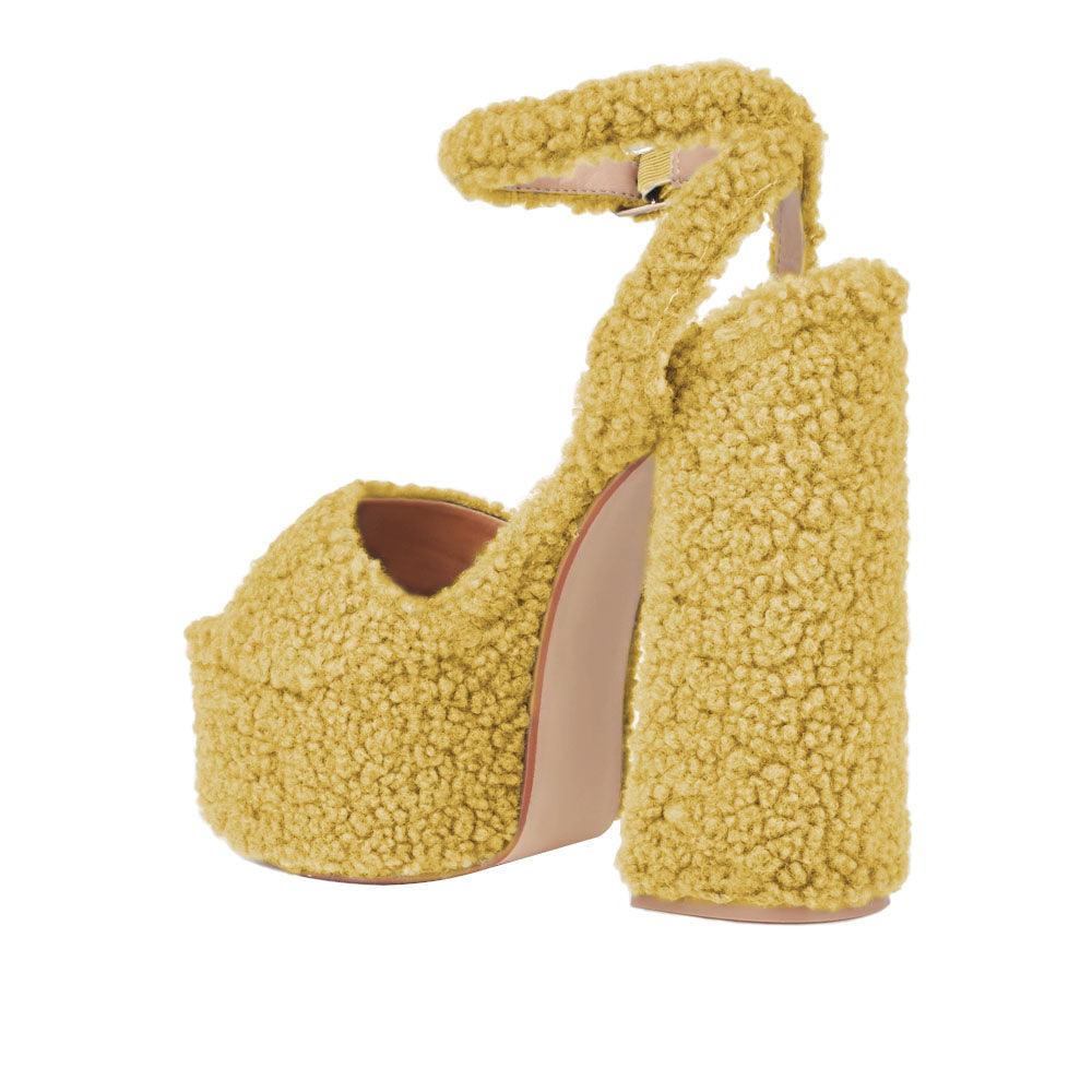 Yellow shag covered women's platform heels-posterior view