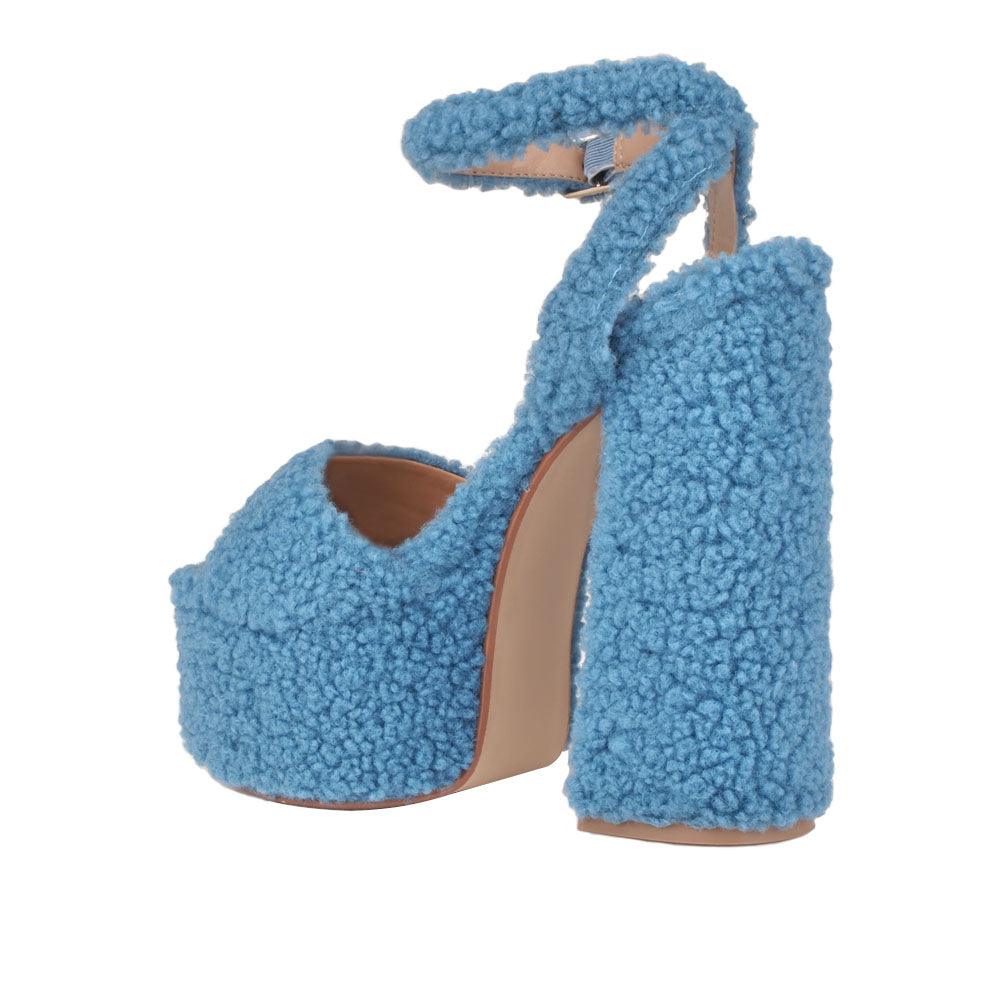 Shag covered women's platform heels in blue-posterior view