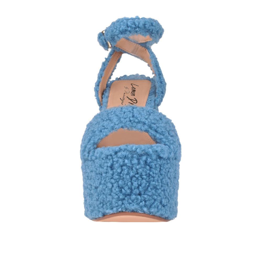 Shag covered women's platform heels in blue-front view