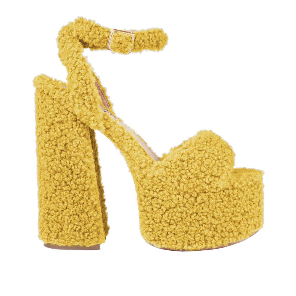 Yellow shag covered women's platform heels-side view